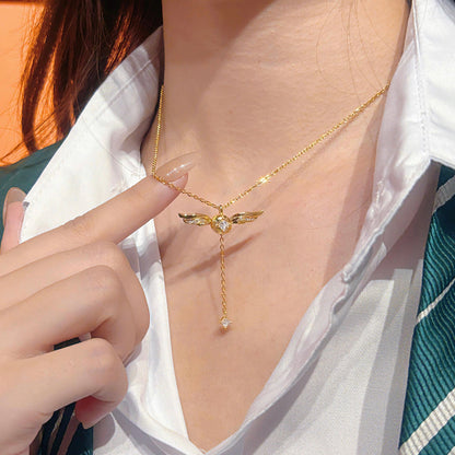 Gold-plated lariat necklace with winged pendant, gold jewellery for women
