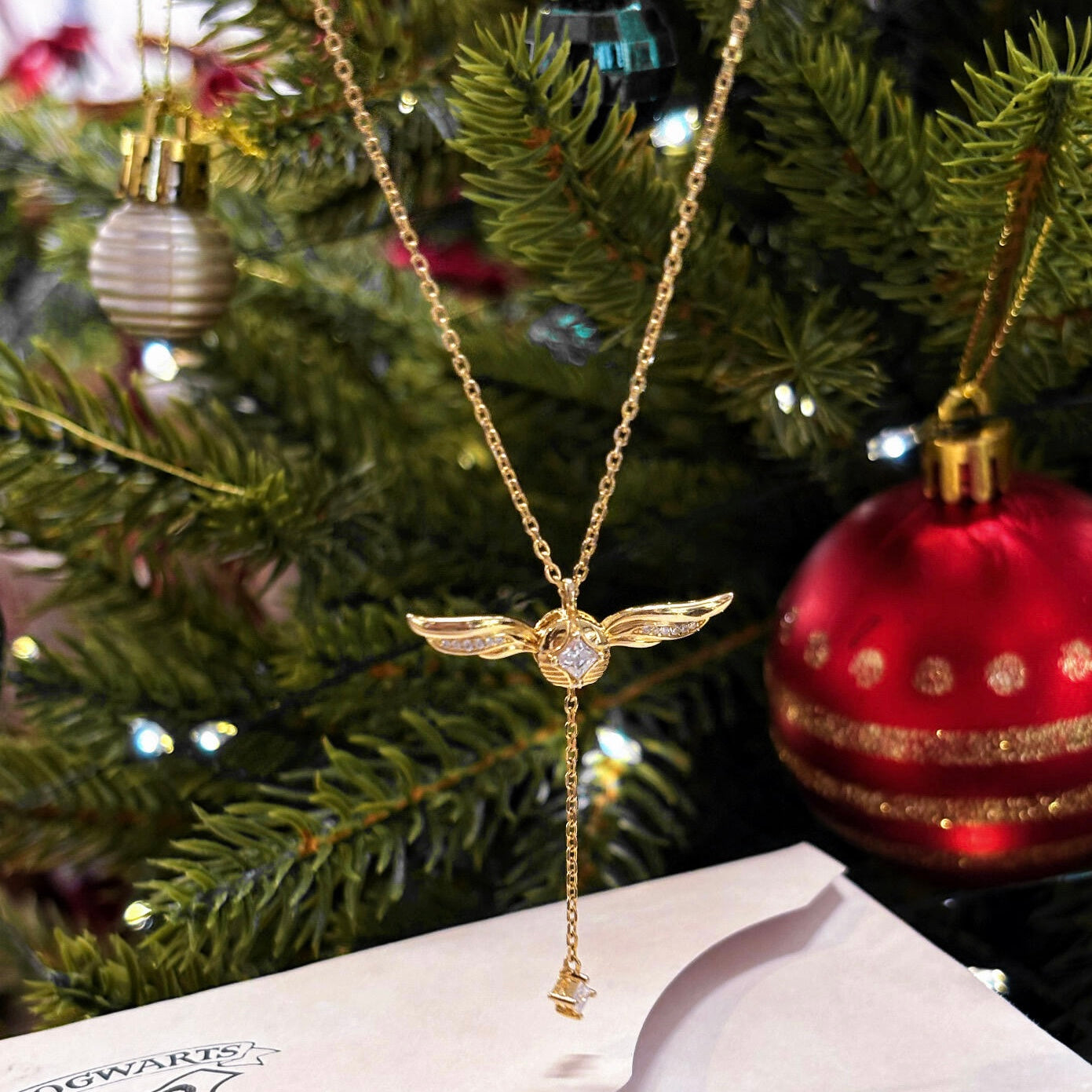 Gold-plated lariat necklace side angle showing Y-chain drop