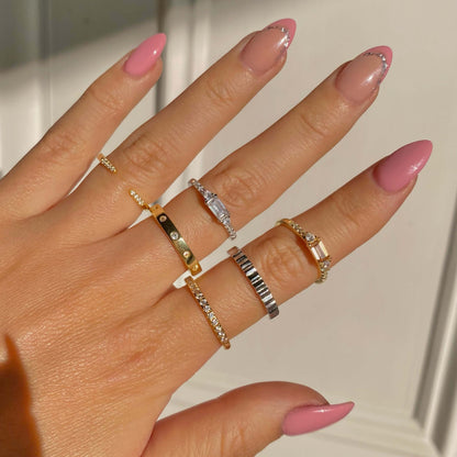 Ravyena Air Ring layered in a ring stack — 18K gold-plated crystal ring