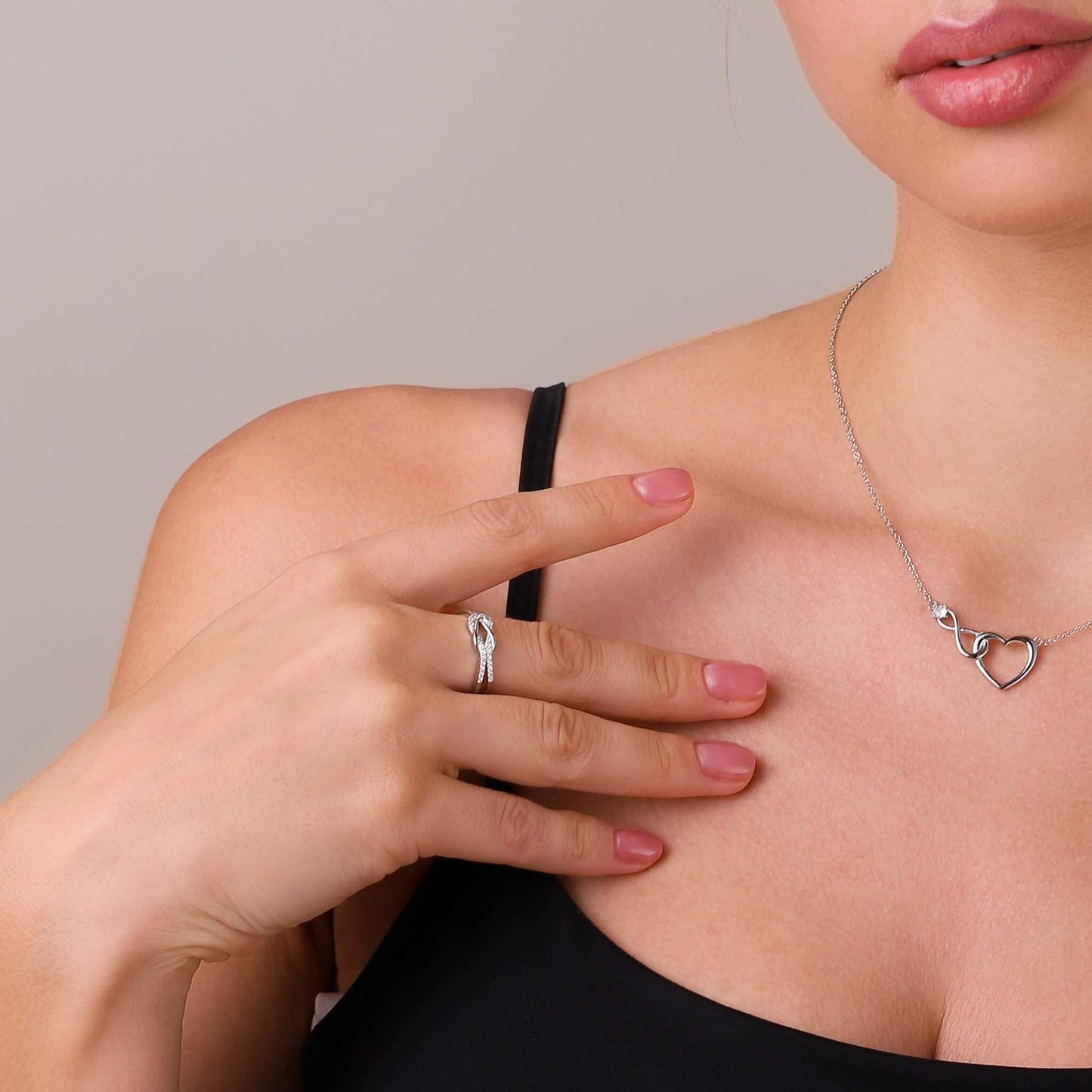 Knot ring styled on a feminine hand