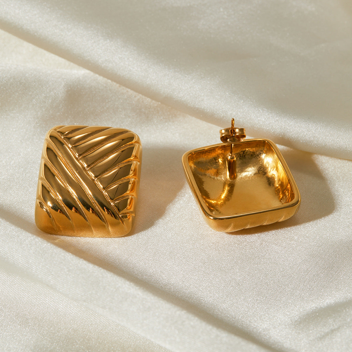 Hand-finished gold earrings with refined texture