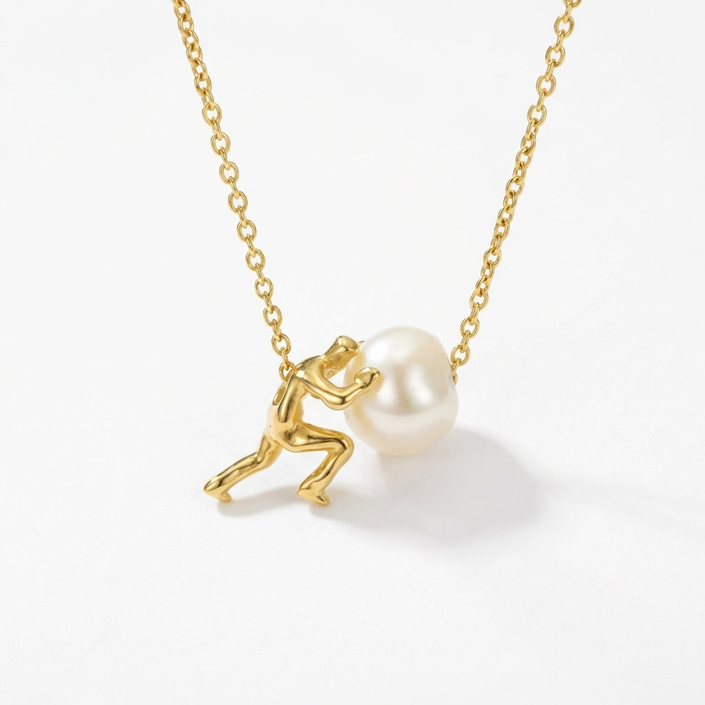 Sisyphus necklace with a gold finish, showcasing a natural pearl and minimalist design