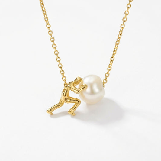 Sisyphus necklace with a gold finish, showcasing a natural pearl and minimalist design