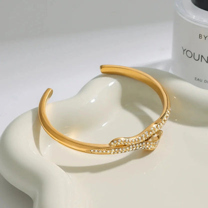 Detail of gold twisted cuff bracelet showing micro crystal accents