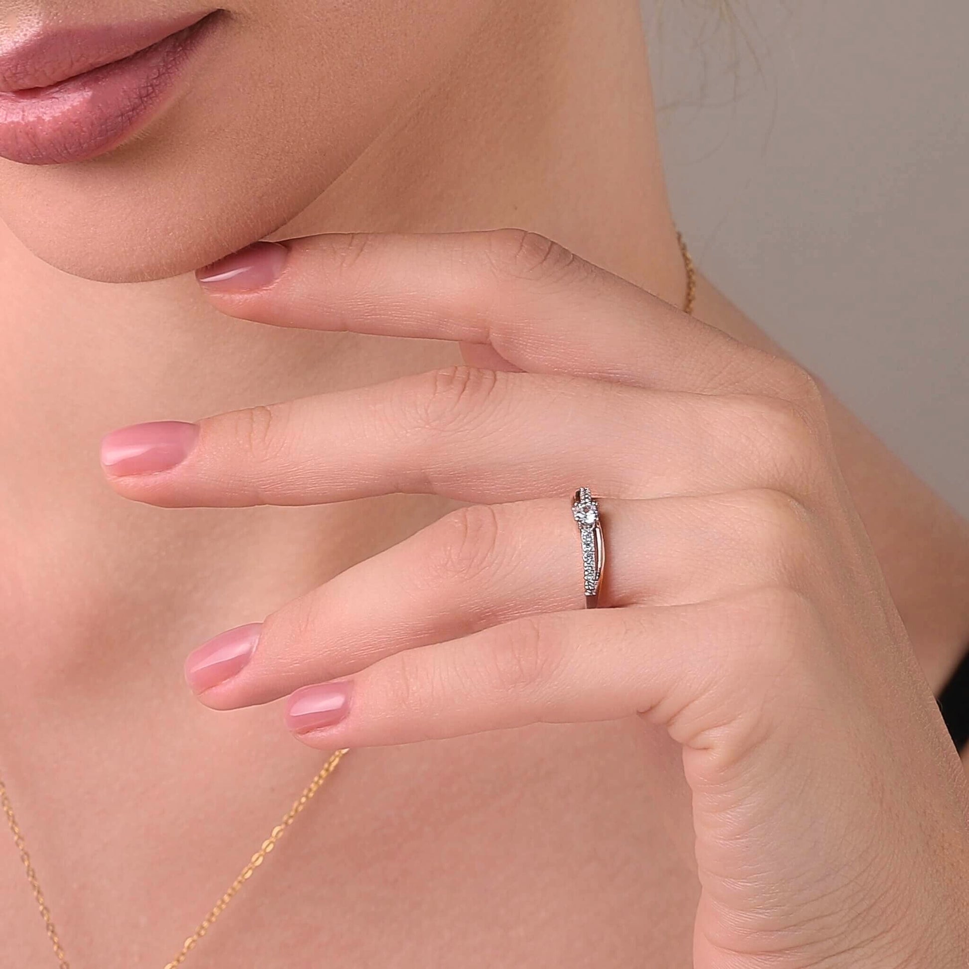 Ups and downs ring styled on a feminine hand