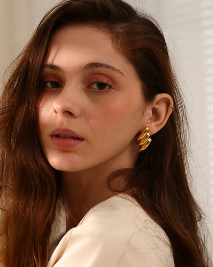 Ravyena Wing Theory earrings styled on model