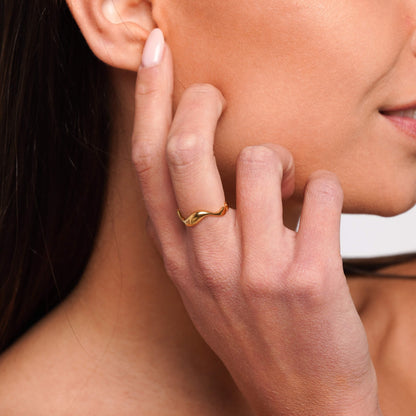 Gold ocean wave ring, sculptural design