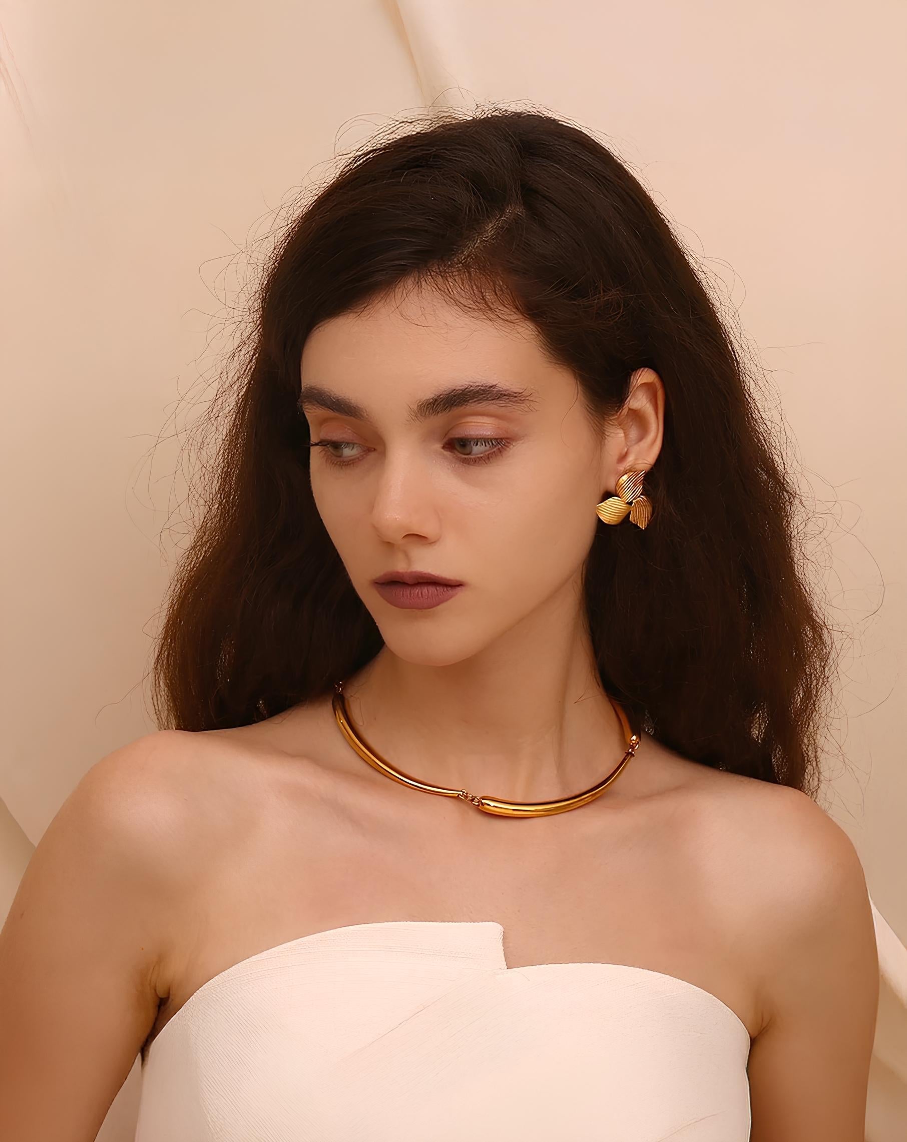 Trio in bloom earrings styled on a model's ear