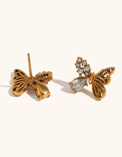 Close-up of gold butterfly earring detail