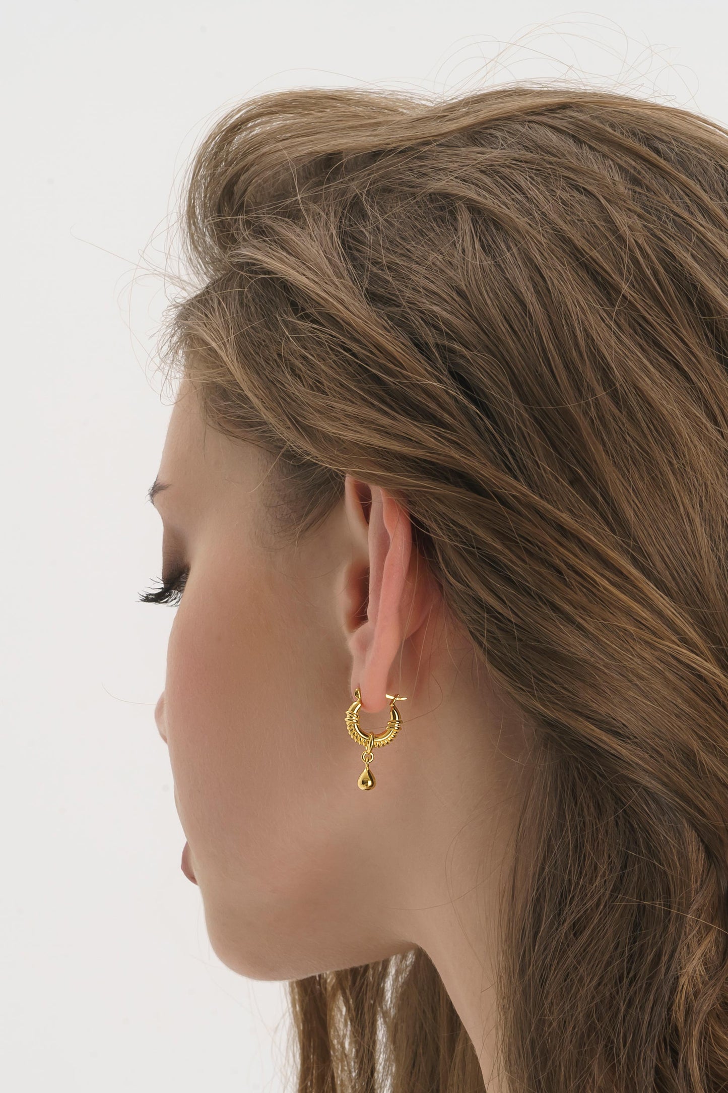 Gold Teardrop Huggie Hoop Earrings side profile 14K gold plated – Ravyena
