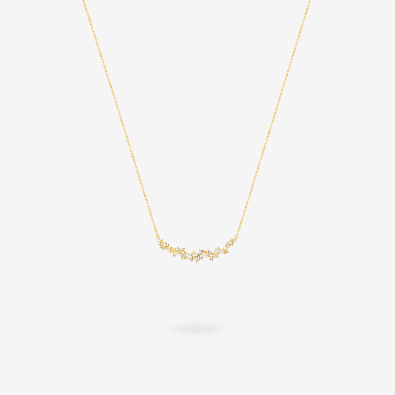 Wisteria bar necklace shown layered with other delicate chains