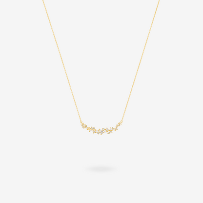 Wisteria bar necklace shown layered with other delicate chains