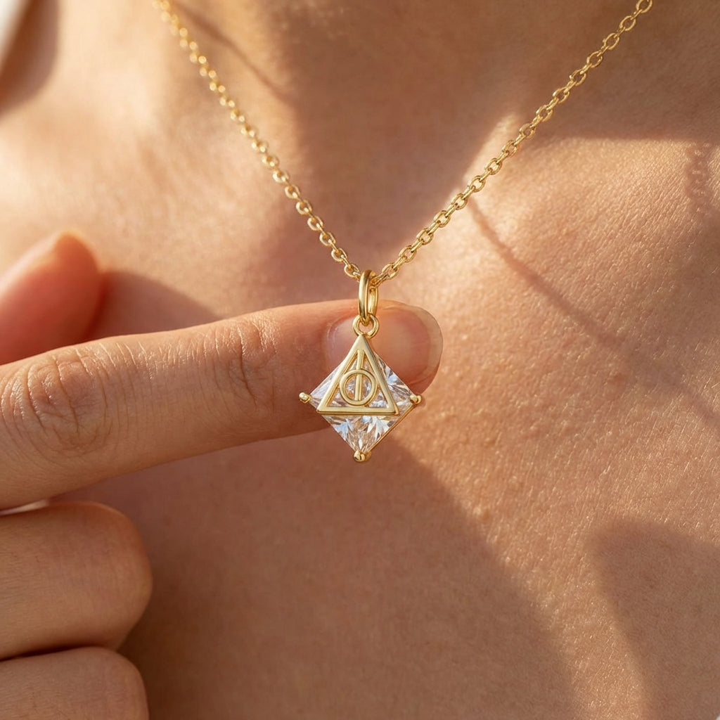 Deathly Hallows sterling silver necklace with gold triangular pendant and clear faceted crystal