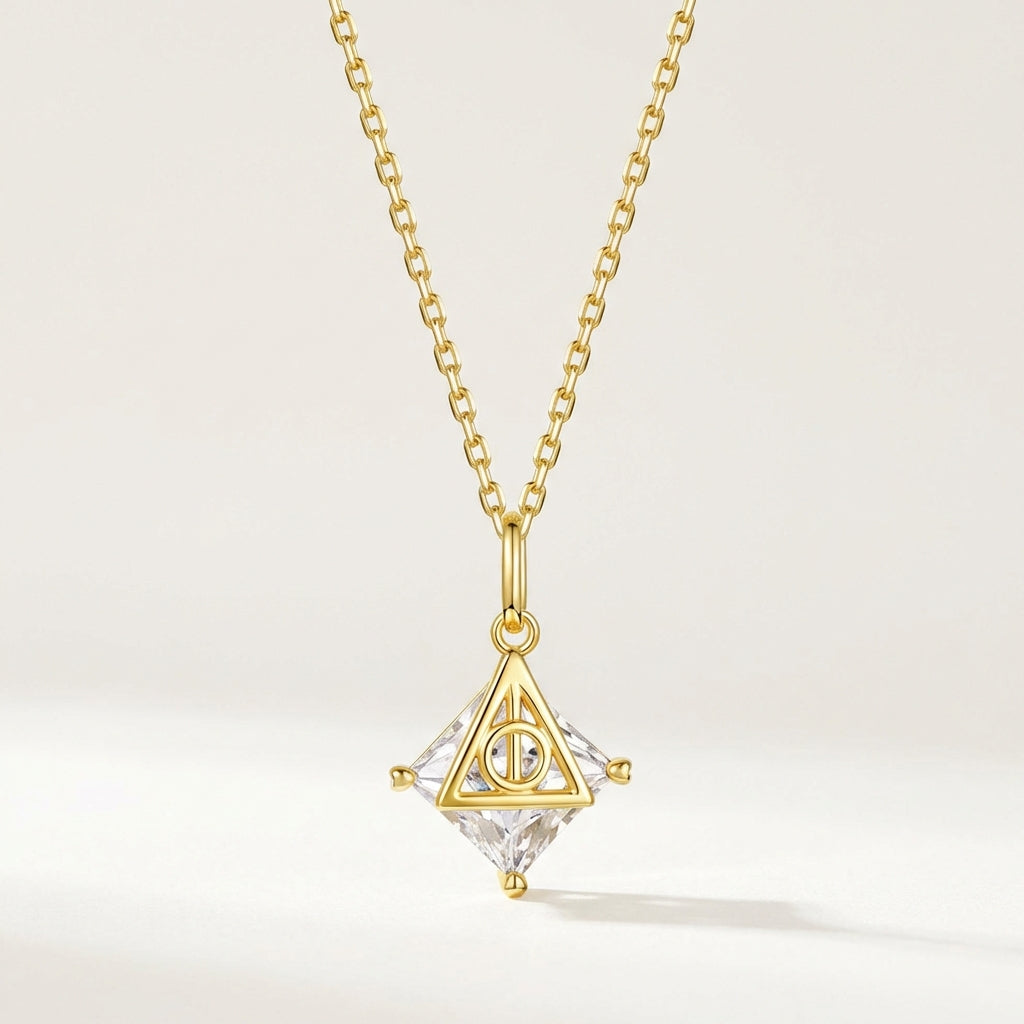 Deathly Hallows sterling silver necklace with gold triangular pendant and clear faceted crystal