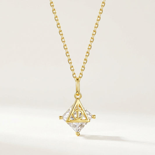 Deathly Hallows sterling silver necklace with gold triangular pendant and clear faceted crystal