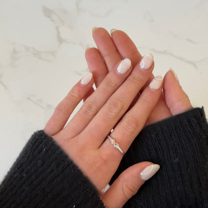 Close-up of gold eternal love ring detail