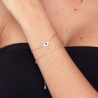 Gold chain bracelet with multiple evil eye charms