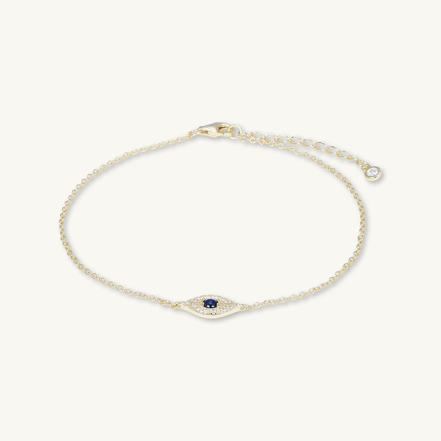 Evil eye chain bracelet on neutral background