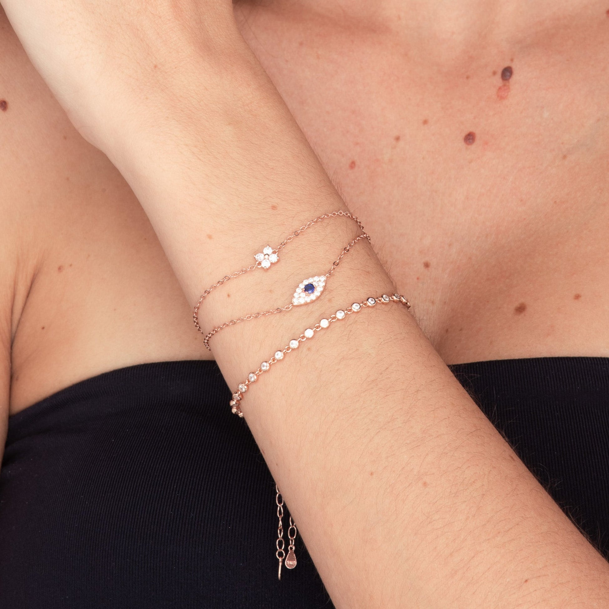 Close-up of pave evil eye chain bracelet detail