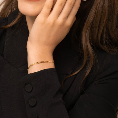 Figaro bracelet styled on a feminine wrist