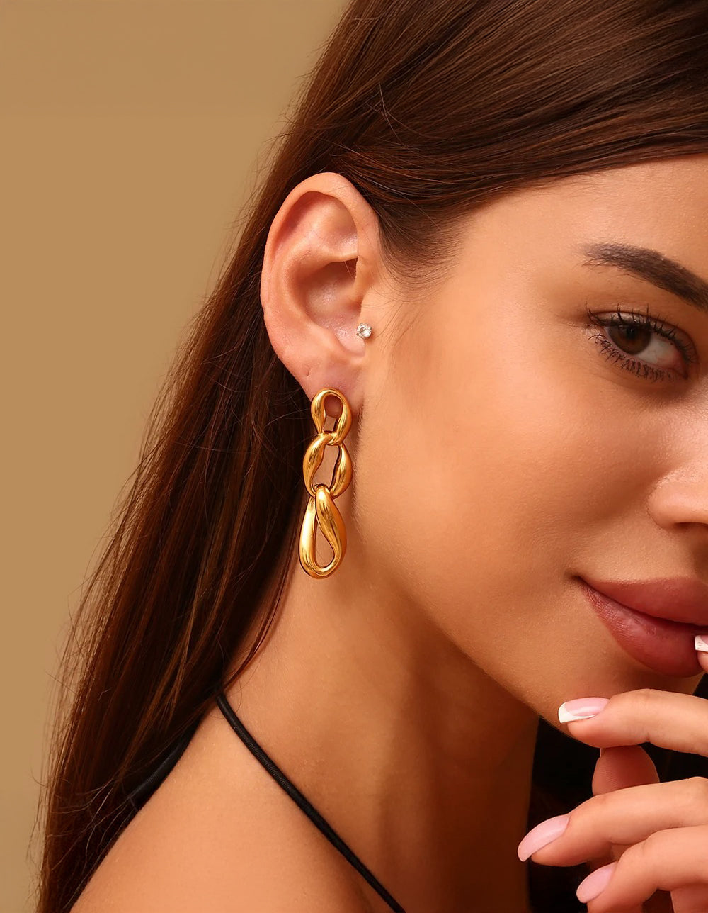 Gold chain link drop earrings — fluid sculptural form