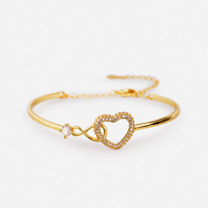 Gold infinity and heart charm bracelet, symbolic delicate jewellery