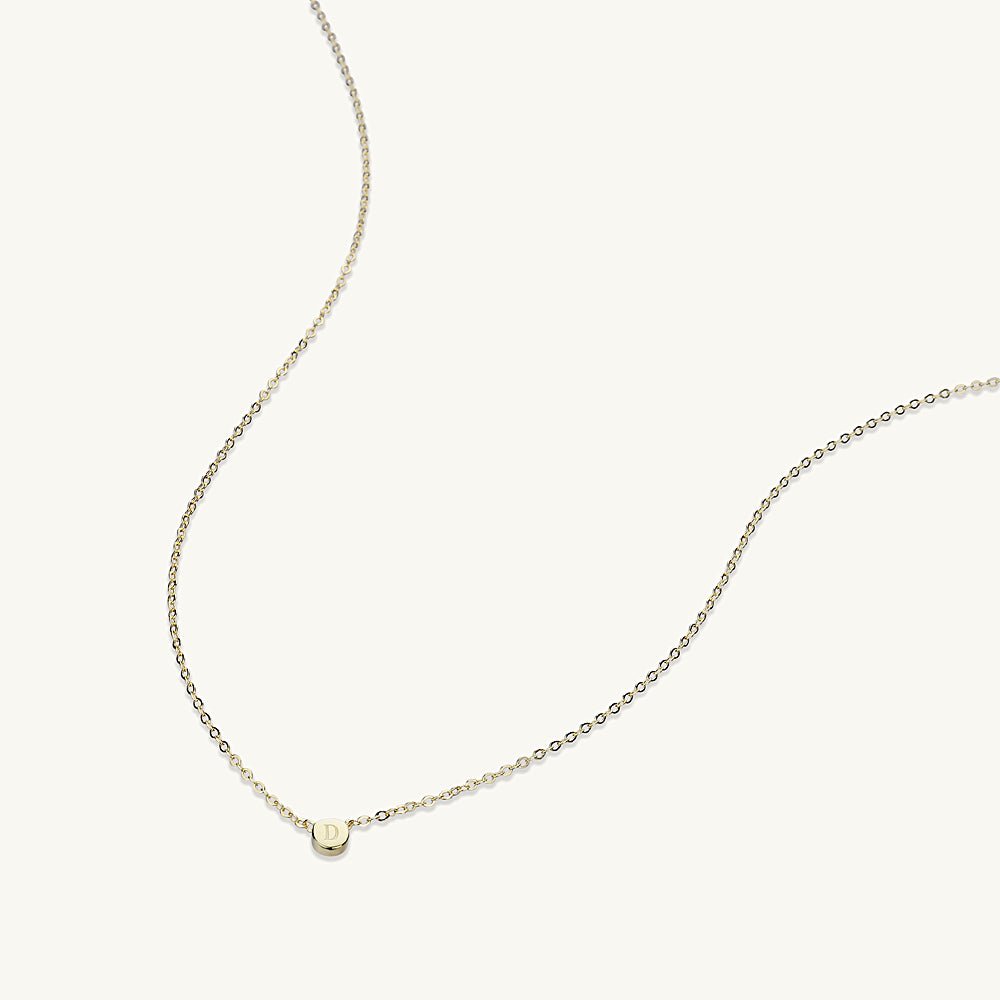Letter dot pendant in gift packaging