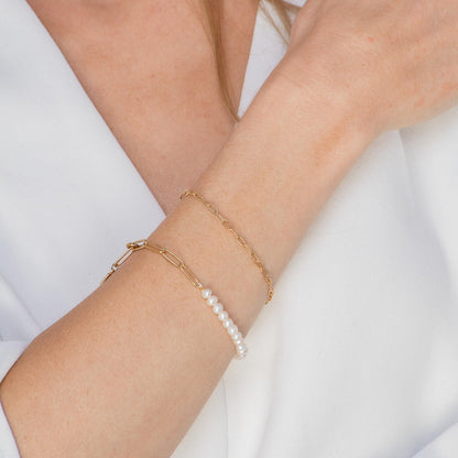 Close-up of gold link chain bracelet detail