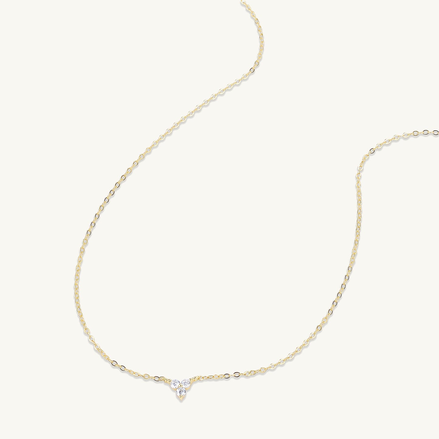 Lotus pendant shown with elegant outfit styling