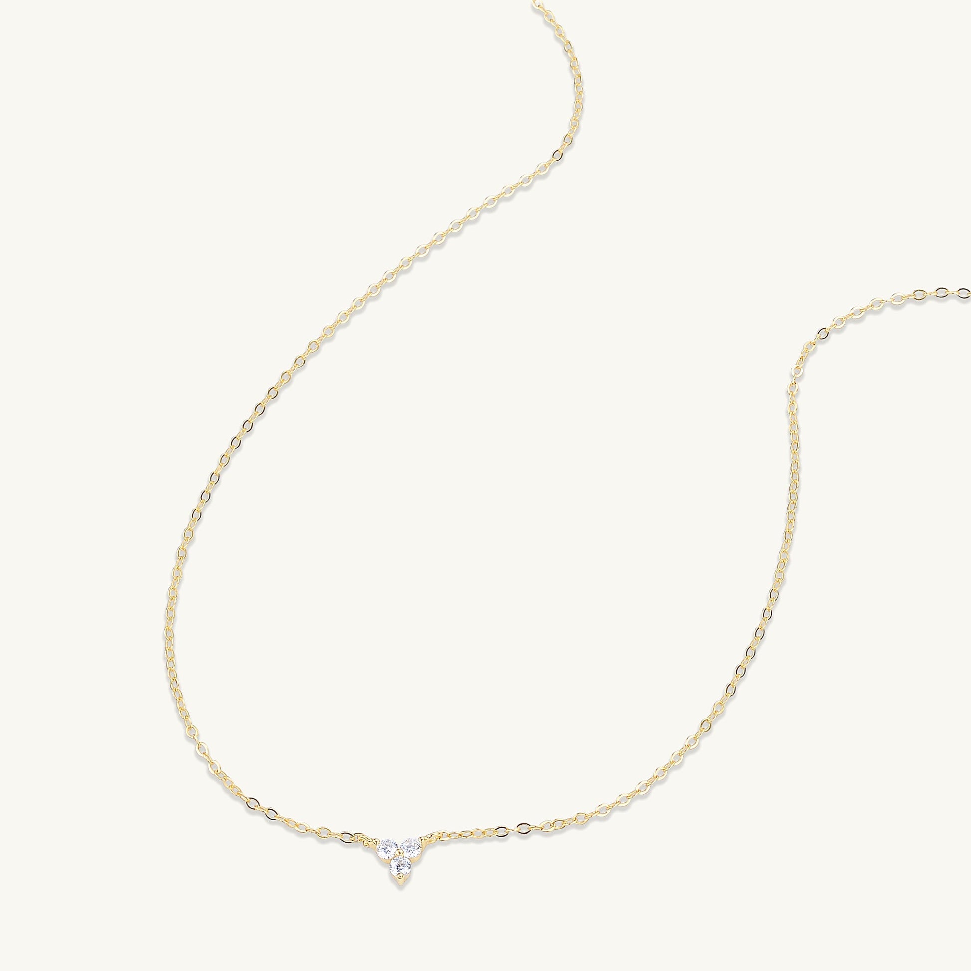 Lotus pendant shown with elegant outfit styling