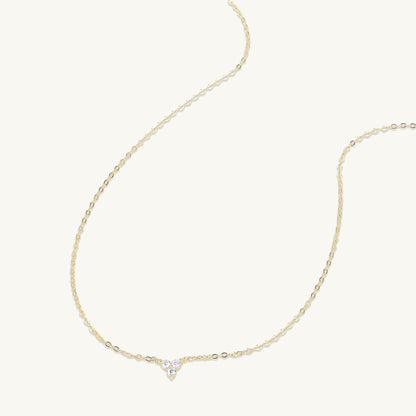 Lotus pendant shown with elegant outfit styling