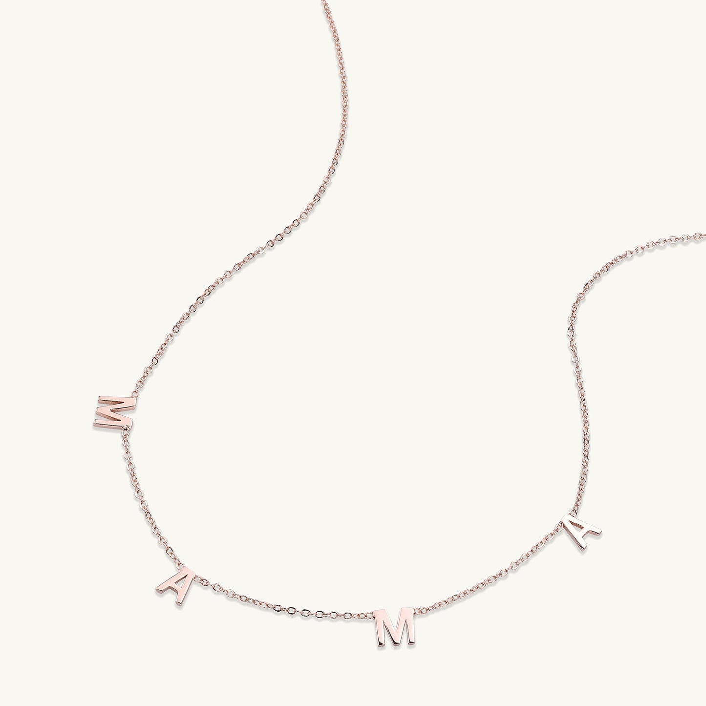 Mama letter necklace detail shot, polished gold
