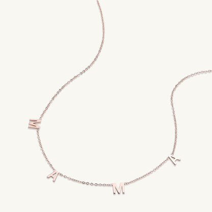Mama letter necklace detail shot, polished gold
