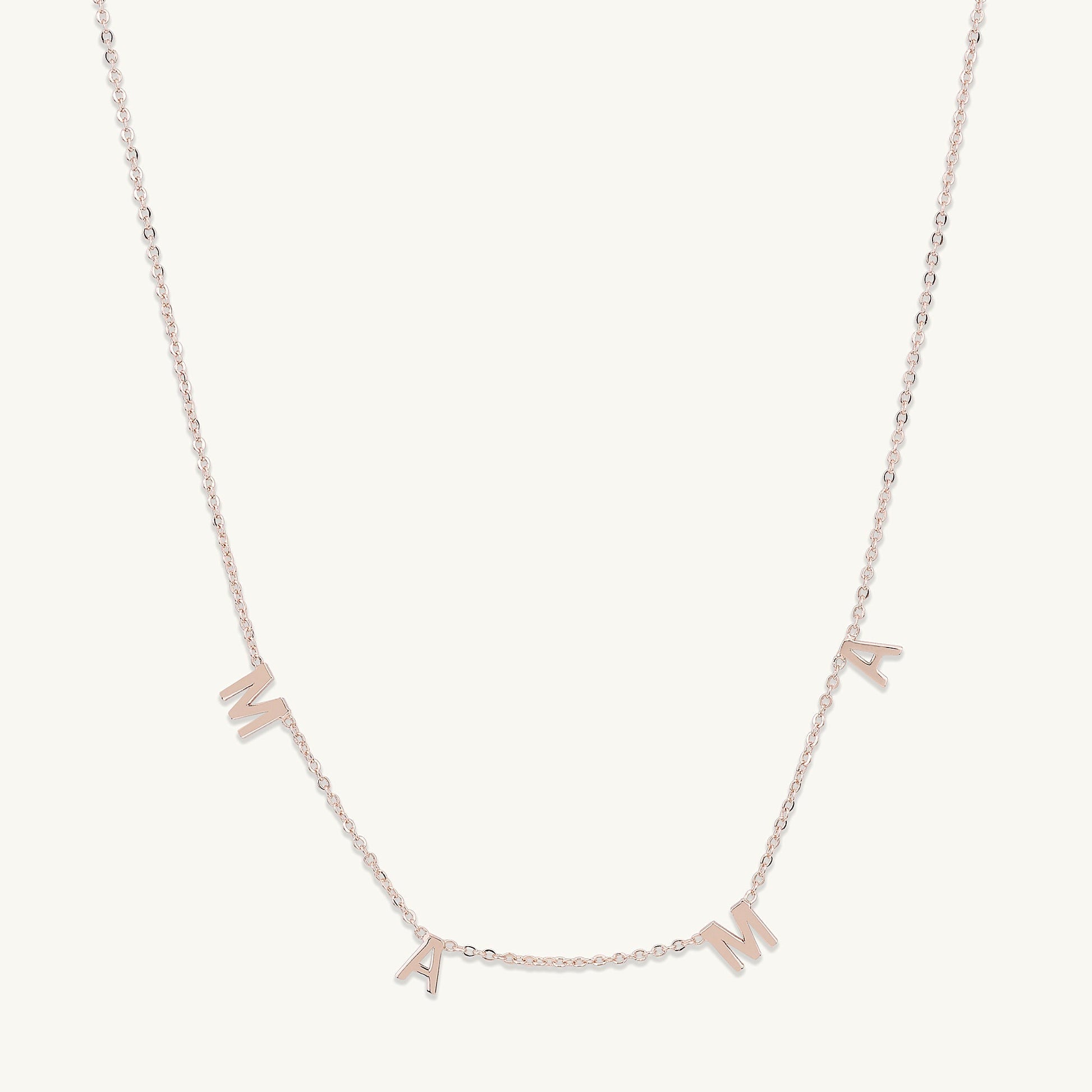 Mama letter necklace shown with elegant outfit