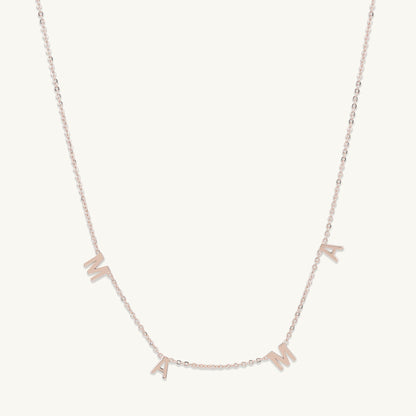 Mama letter necklace shown with elegant outfit