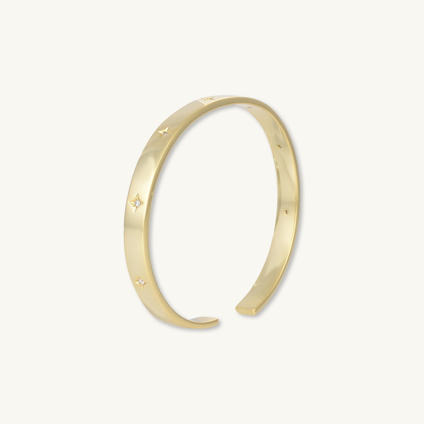 Gold star bangle, refined feminine design