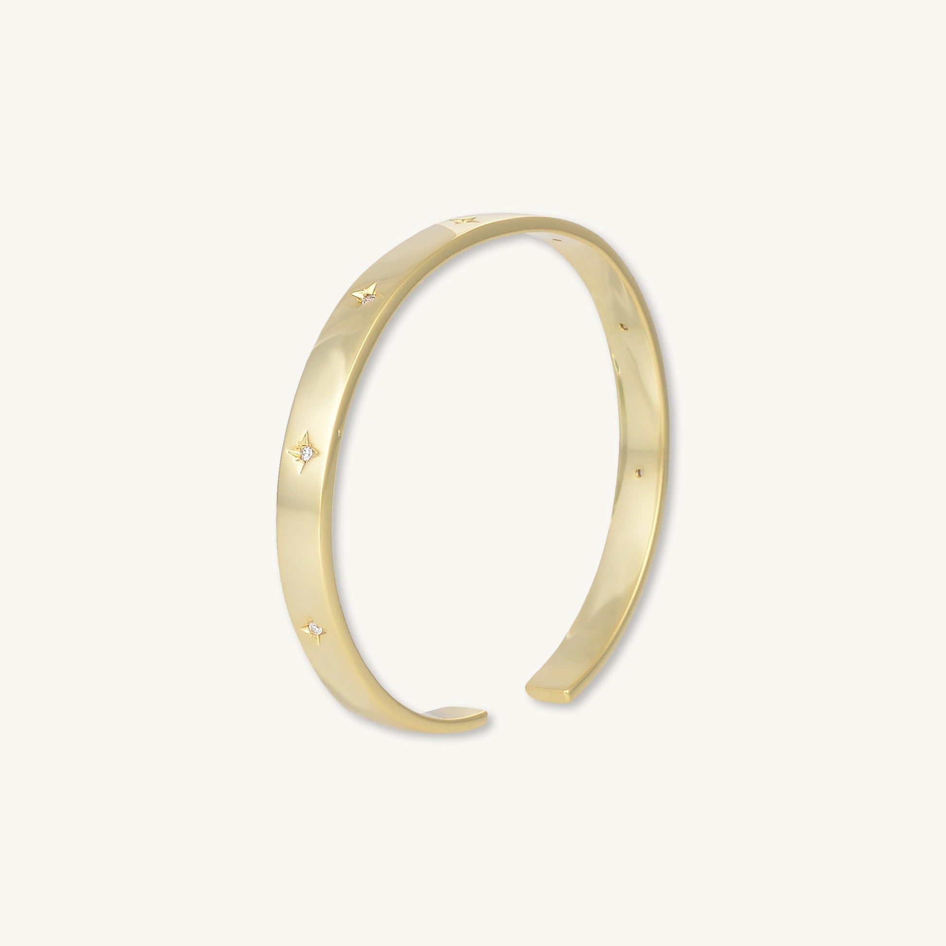 Gold star bangle, refined feminine design