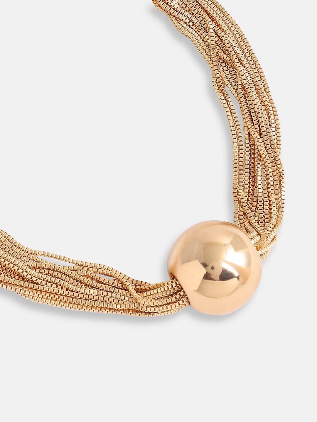 Gold layered necklace shown layered with other delicate chains