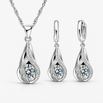 Twist Teardrop Crystal Necklace & Earring Set in Clear, product view on a white background - Ravyena