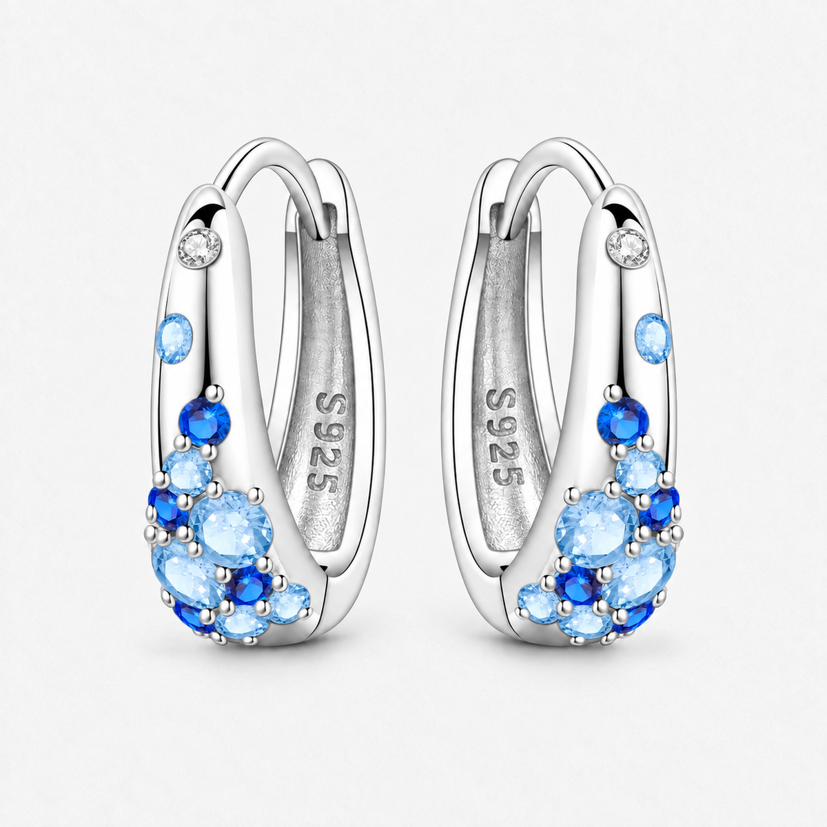 Sterling Silver Colour Crystal Hoop Earrings in Blue, product view on a white background - Ravyena