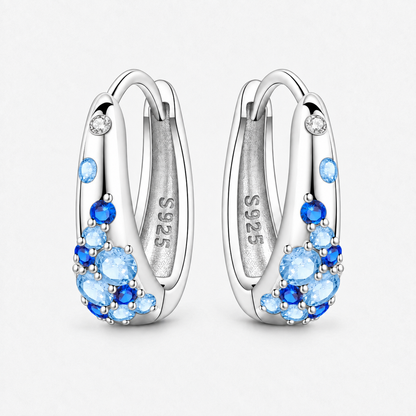 Sterling Silver Colour Crystal Hoop Earrings in Blue, product view on a white background - Ravyena