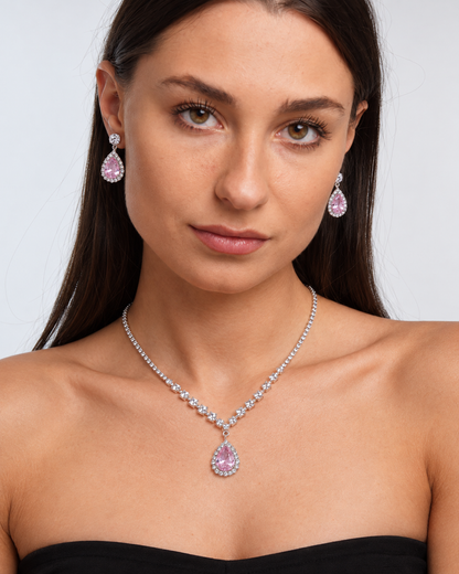 Crystal Teardrop Necklace & Earring Set in Silver / Pink, worn by a model in a front portrait - Ravyena