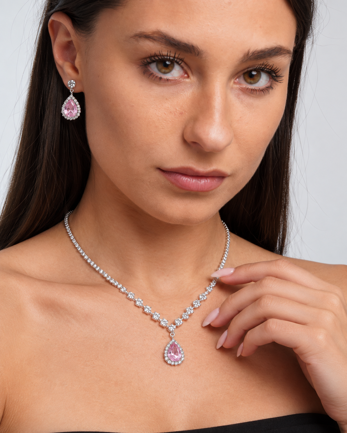 Crystal Teardrop Necklace & Earring Set in Silver / Pink, worn by a model in a close-up - Ravyena