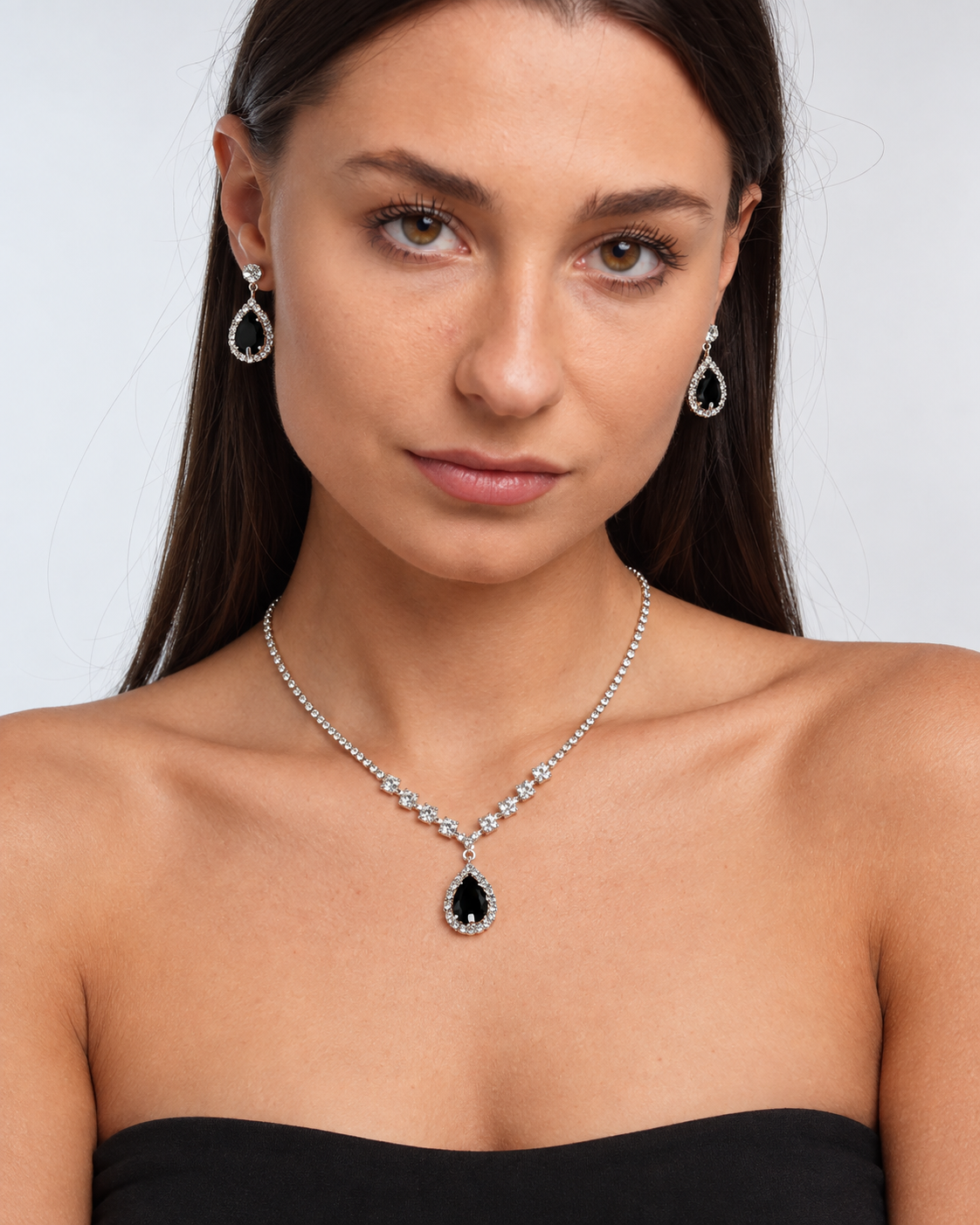 Crystal Teardrop Necklace & Earring Set in Silver / Black, worn by a model in a front portrait - Ravyena