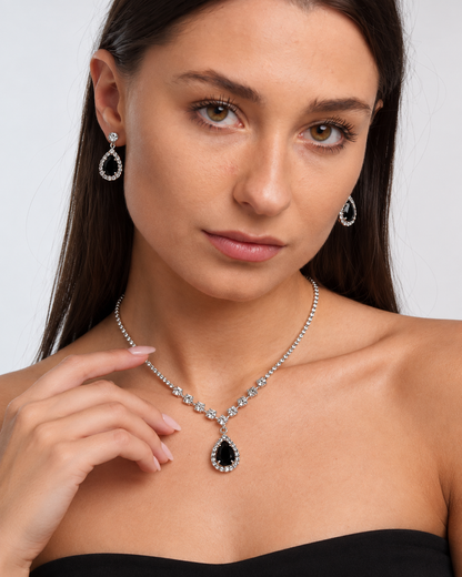 Crystal Teardrop Necklace & Earring Set in Silver / Black, worn by a model in a close-up - Ravyena