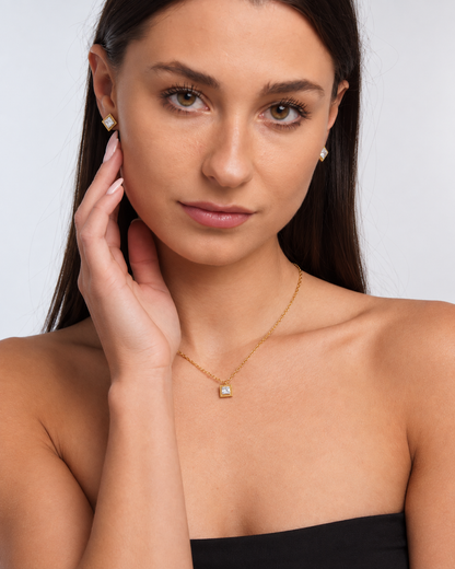 Gold Square Crystal Necklace & Stud Earring Set in Gold, worn by a model in a front portrait - Ravyena