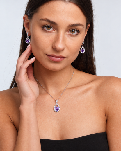 Silver-Tone Teardrop Crystal Necklace & Earring Set in Purple, worn by a model in a front portrait - Ravyena