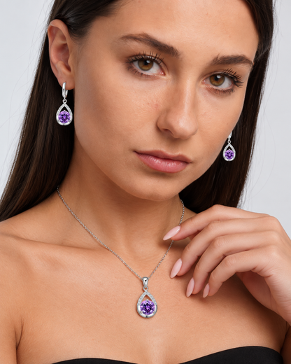 Silver-Tone Teardrop Crystal Necklace & Earring Set in Purple, worn by a model in a close-up - Ravyena