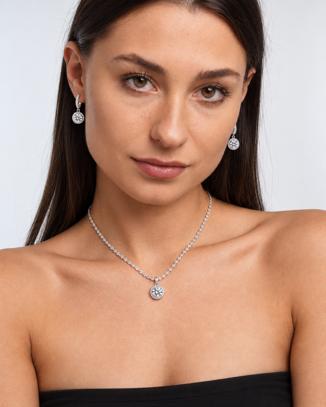 925 Sterling Silver Round Crystal Necklace & Earring Set in Clear, worn by a model in a front portrait - Ravyena