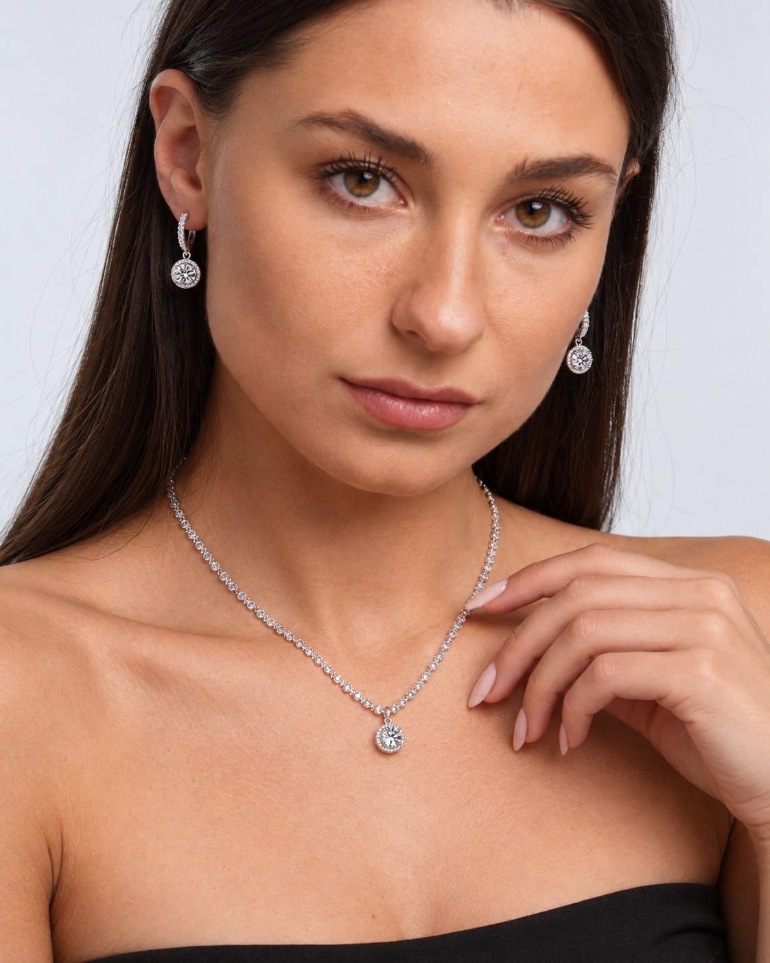 925 Sterling Silver Round Crystal Necklace & Earring Set in Clear, worn by a model in a close-up - Ravyena